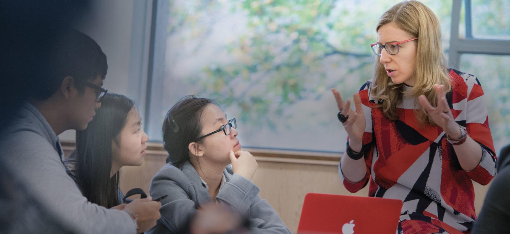 Student and a professor discuss an augmented reality app about the Syrian civil war during a UBC geography class