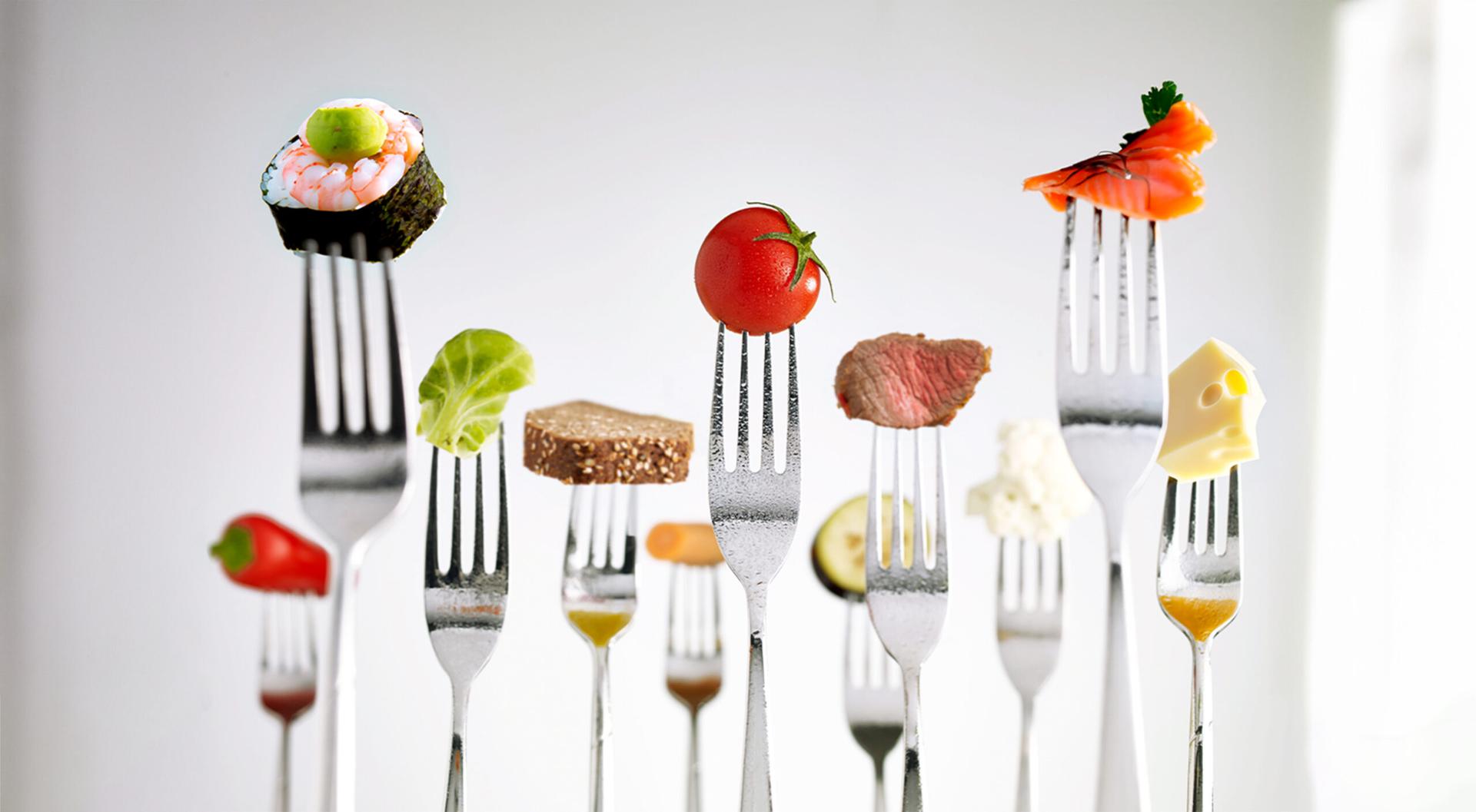 Different foods on forks