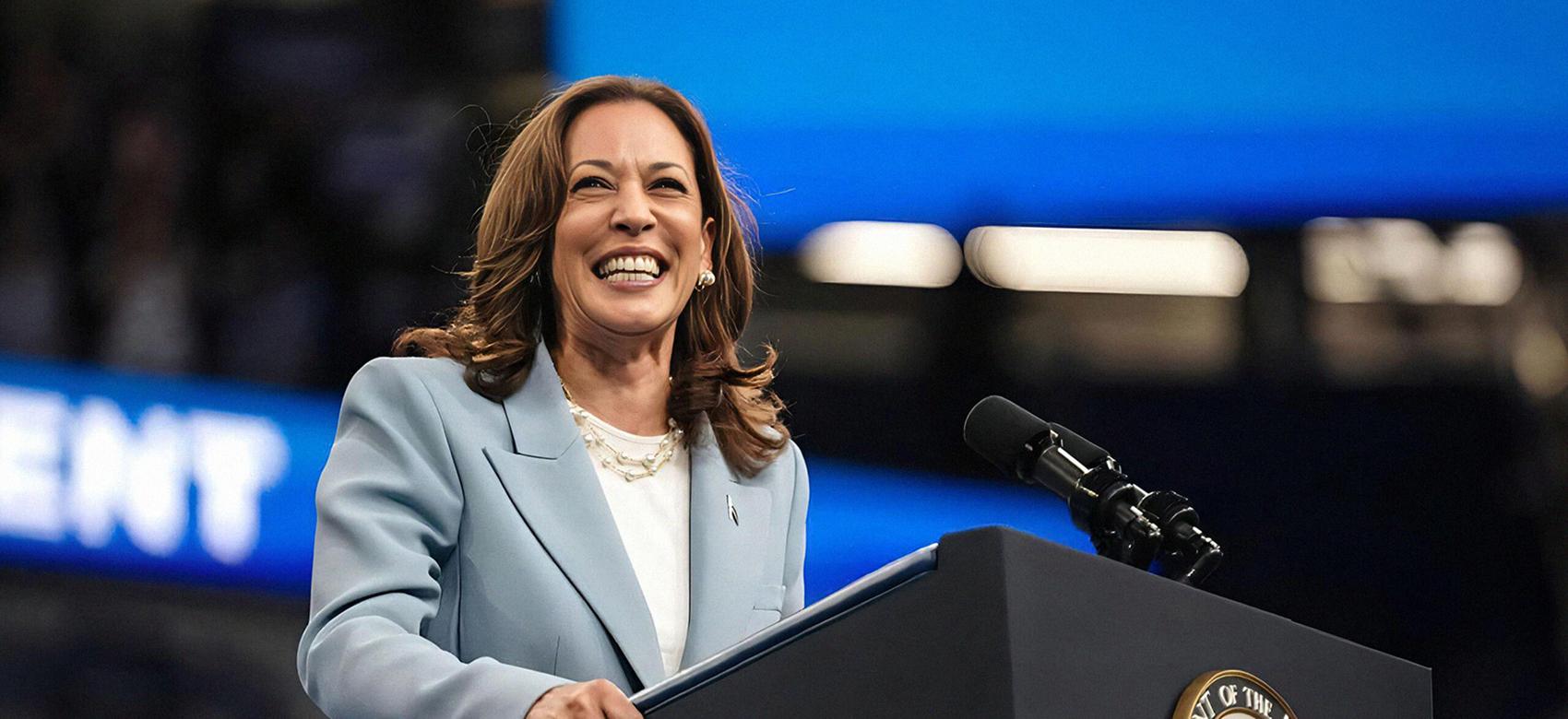 US Vice President and 2024 Democratic presidential candidate Kamala Harris smiles as she takes the podium to speak at a campaign rally in Atlanta, Georgia, on July 30, 2024.