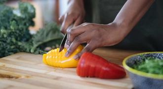 Woman cutting peppers