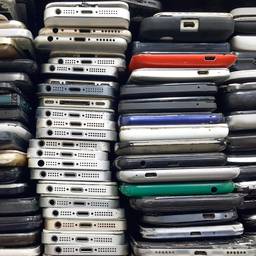 Photo of broken smart phones in stacks