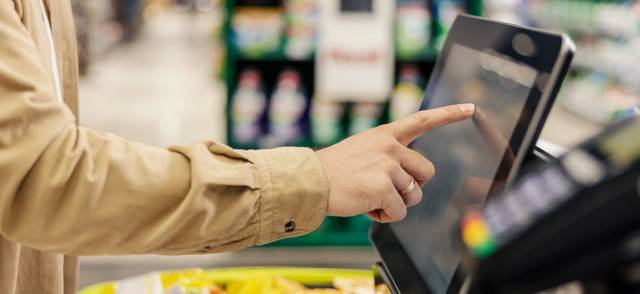 Purchasing at self-service checkout in supermarket