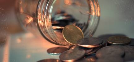 Money kept in a jar for financial savings