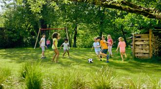 Children play football outdoor