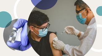 A medical professional gives a COVID-19 vaccine to an adult