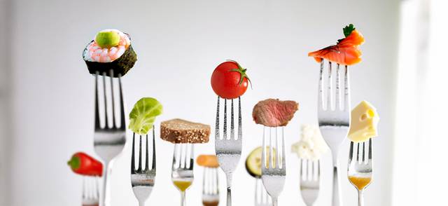 Different foods on forks