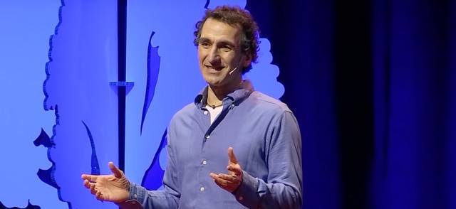 Photo of Dr. Simon Donner on stage at Ted X