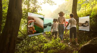 A family in the forest with social media ads popping up around them
