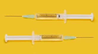 Two syringes with the COVID-19 vaccine.